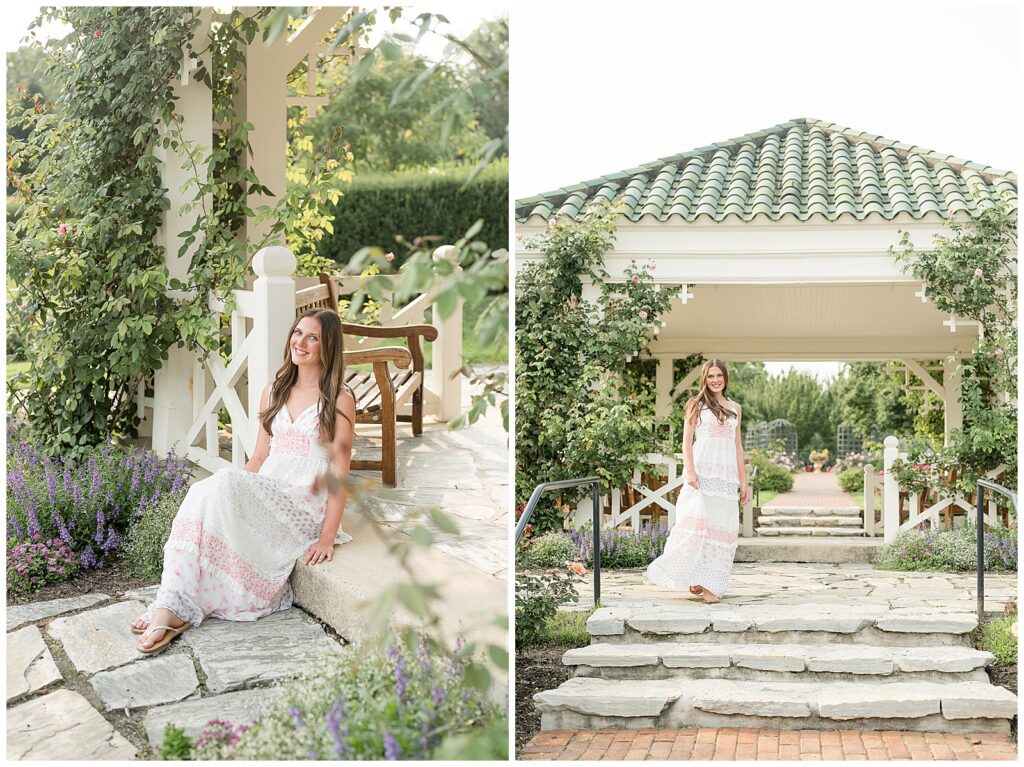 Senior in a white floral dress posing beneath a white vine-covered pergola at Hershey Gardens during her Lancaster PA senior portrait session